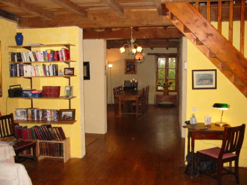 the living room, with stairs to two  bedrooms